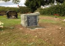 <p>Welsh slate plaque set in Criggon granite boulder</p>